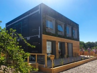 Urbanes Bauen der Zukunft: Ein Team der FH Aachen entwarf ein Gebäude in Holzständerbauweise für eine zwölfköpfige Wohngemeinschaft. Eine kleine Version ist auf dem Solar Campus in Wuppertal zu sehen.