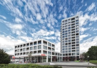 Als gelungene Symbiose aus Raumplanung und Energieeffizienz bildet der Osterwalder Tower ein neues, modernes Wahrzeichen im Norden von Zürich.<br />Bild: Taconova