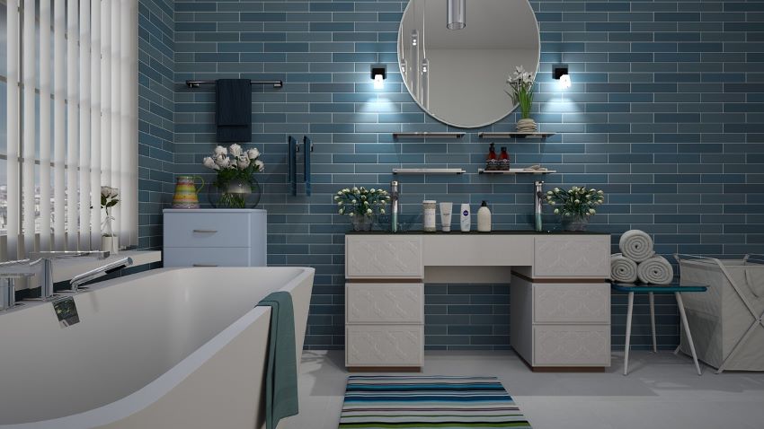 Ein Badezimmer mit zwei Waschbecken, Dusche und Wanne...